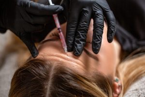 lady during Forehead Botox session at novomed in Riyadh